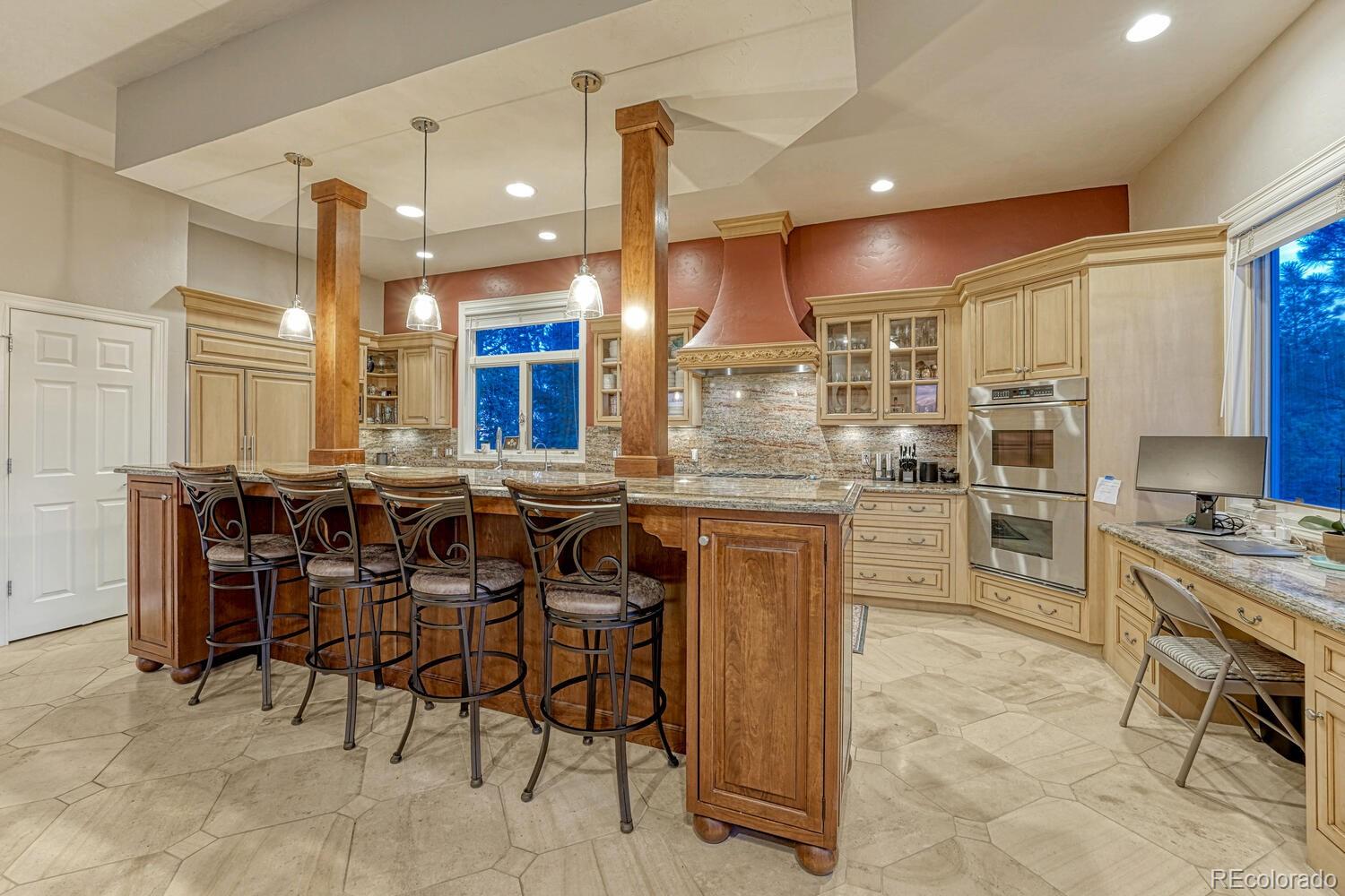 26344 Independence Trail Evergreen, CO 80439 - Photo 10 of 50 a kitchen with a table and chairs in it