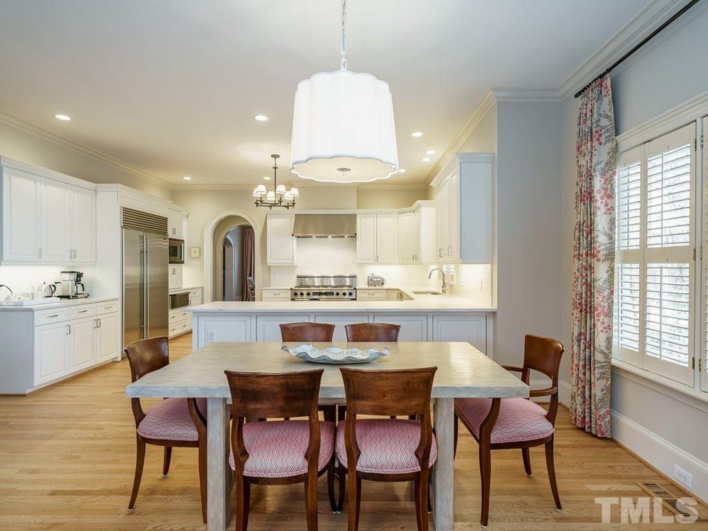 2304 White Oak Road Raleigh, NC 27608 - Photo 13 of 30 a view of a dining room with furniture window and wooden floor