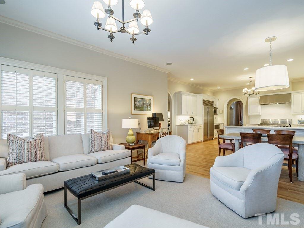 2304 White Oak Road Raleigh, NC 27608 - Photo 14 of 30 a living room with furniture chandelier and a large window
