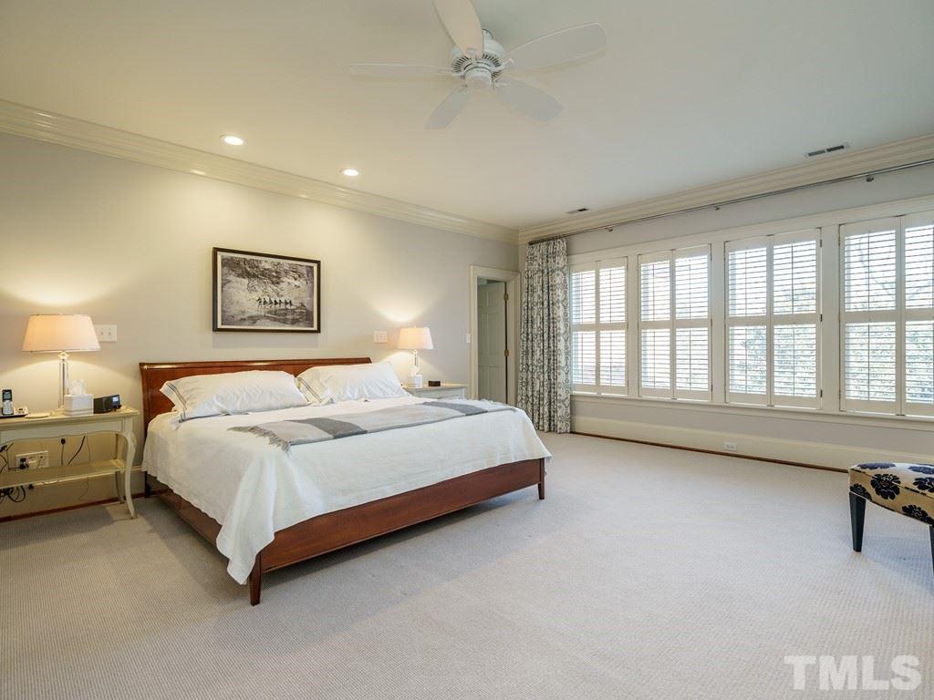 2304 White Oak Road Raleigh, NC 27608 - Photo 18 of 30 a spacious bedroom with a bed and a large window