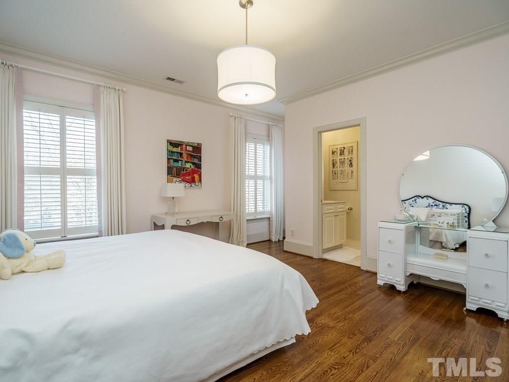2304 White Oak Road Raleigh, NC 27608 - Photo 20 of 30 a bedroom with a bed and a dresser