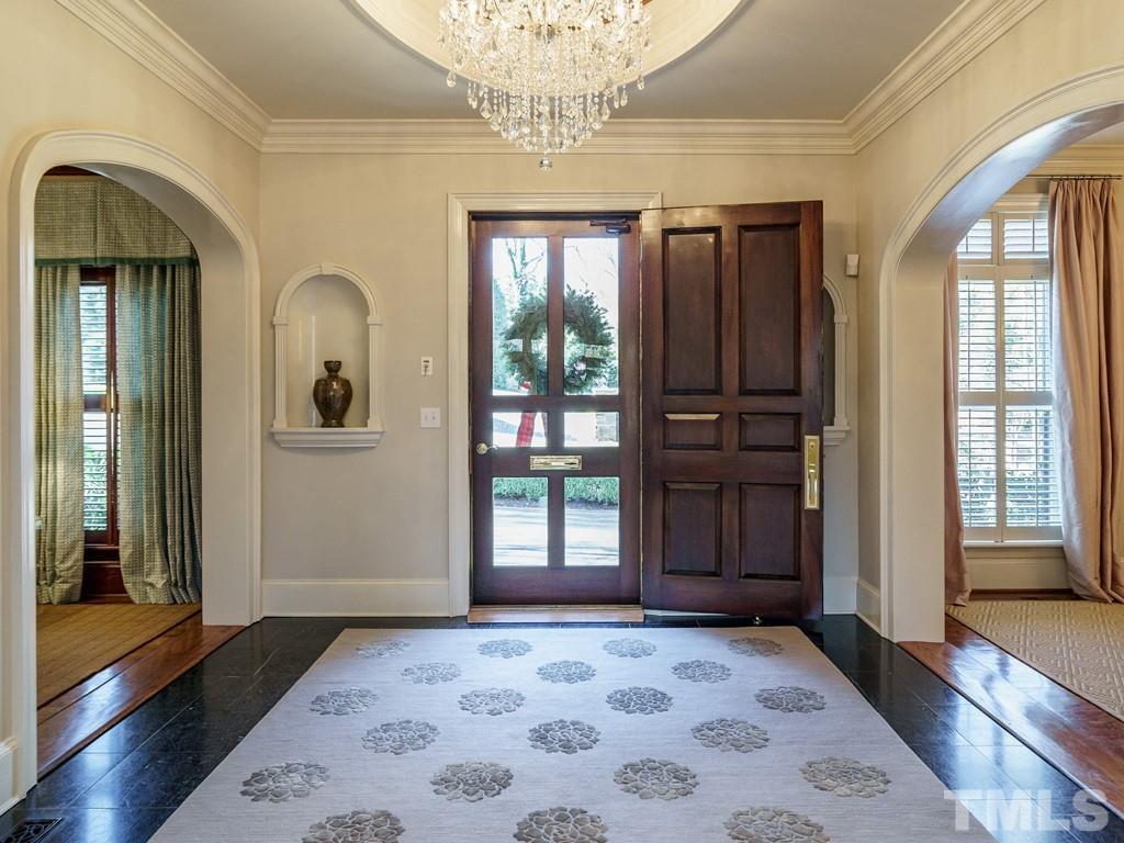 2304 White Oak Road Raleigh, NC 27608 - Photo 3 of 30 a view of a hallway with wooden floor and windows
