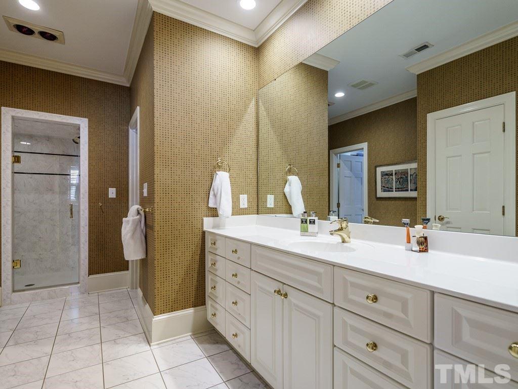 2304 White Oak Road Raleigh, NC 27608 - Photo 22 of 30 a spacious bathroom with a double vanity sink and a mirror