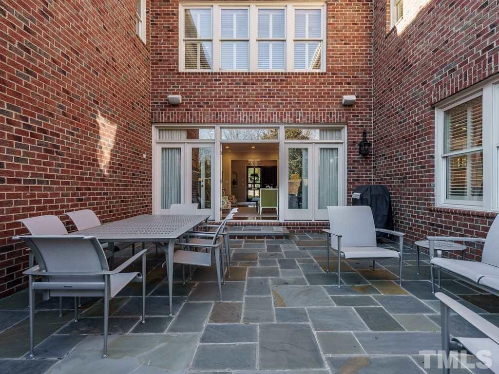 2304 White Oak Road Raleigh, NC 27608 - Photo 24 of 30 a view of a building with a table and chairs