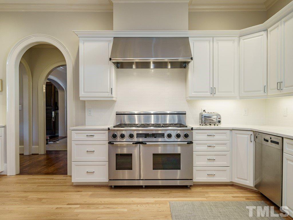 2304 White Oak Road Raleigh, NC 27608 - Photo 10 of 30 a kitchen with stainless steel appliances granite countertop a stove and a cabinets