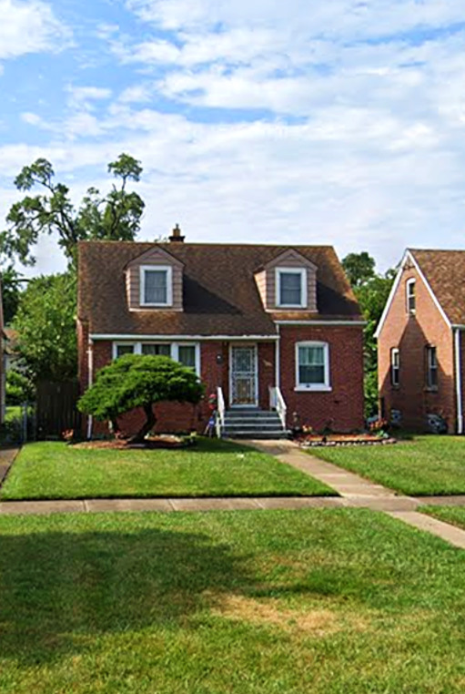 104 East 150th Street Harvey, IL 60426 - Photo 1 of 25 a front view of a house with a yard
