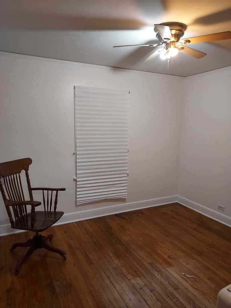 104 East 150th Street Harvey, IL 60426 - Photo 15 of 25 a view of a livingroom with a hardwood floor