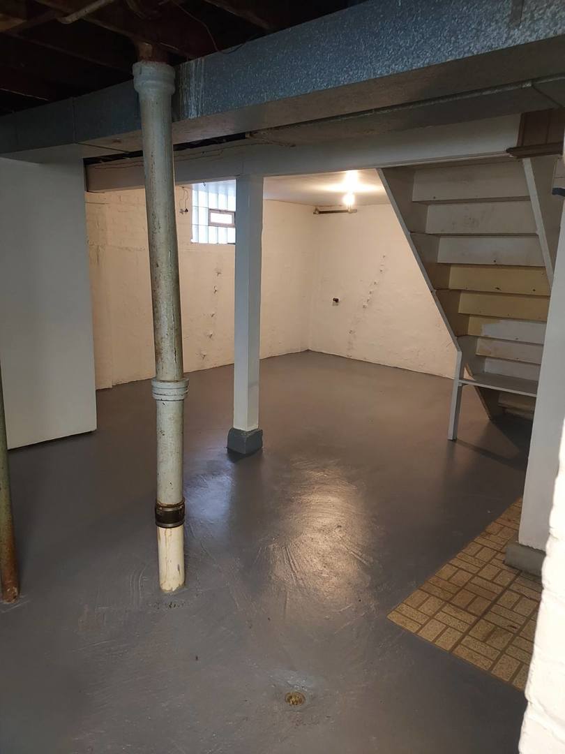 104 East 150th Street Harvey, IL 60426 - Photo 20 of 25 a view of empty room with wooden floor
