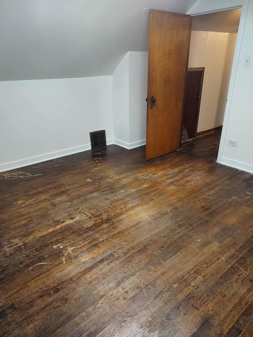 104 East 150th Street Harvey, IL 60426 - Photo 8 of 25 a view of an empty room