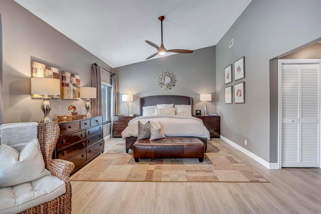 4600 Southwest 164th Terrace Southwest Ranches, FL 33331 - Photo 11 of 36 a bedroom with a large bed a flat tv screen and dresser