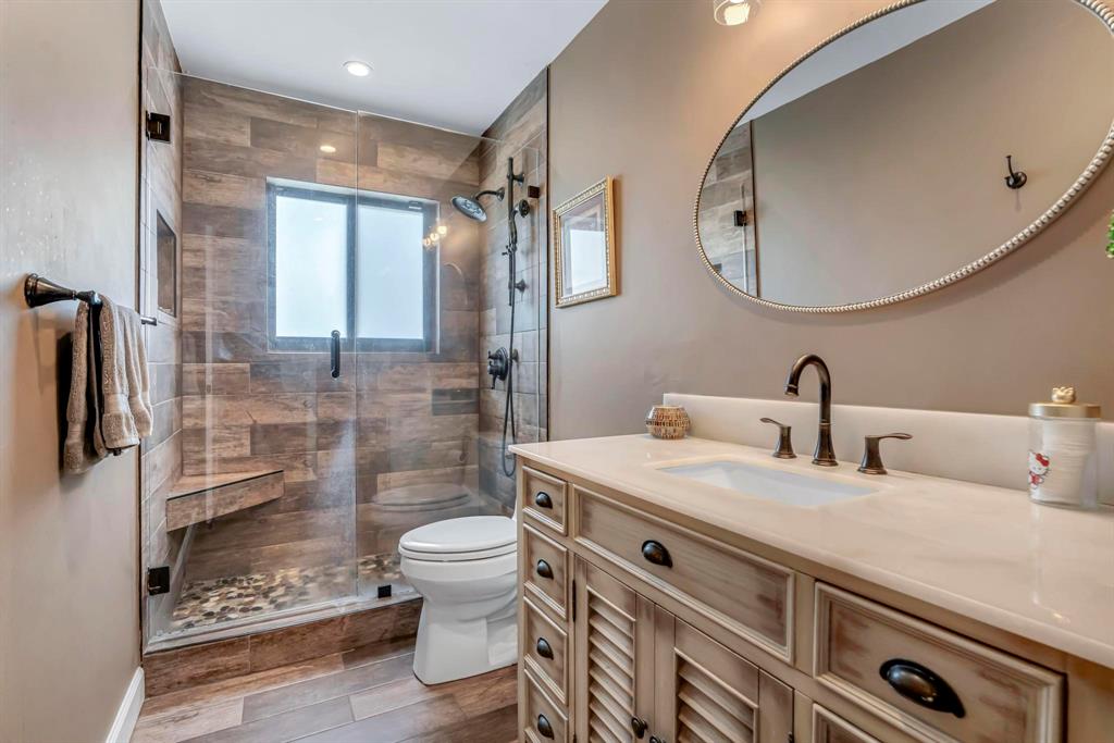 4600 Southwest 164th Terrace Southwest Ranches, FL 33331 - Photo 17 of 36 a bathroom with a double vanity sink toilet and shower