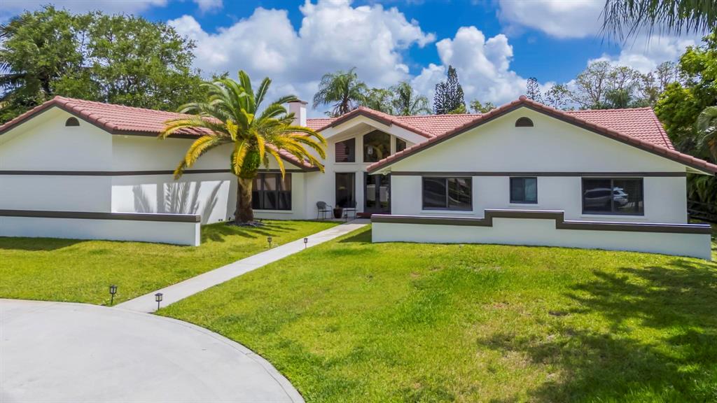 4600 Southwest 164th Terrace Southwest Ranches, FL 33331 - Photo 2 of 36 a house with swimming pool in front of it