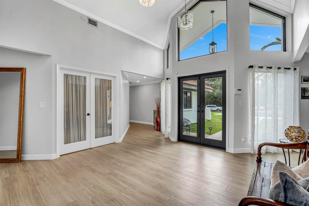 4600 Southwest 164th Terrace Southwest Ranches, FL 33331 - Photo 23 of 36 a view of a hallway with wooden floor and windows