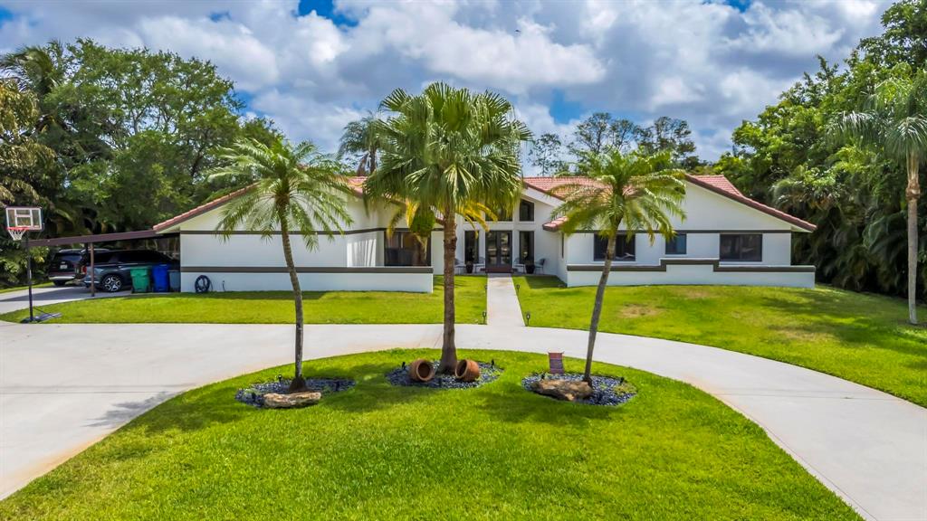 4600 Southwest 164th Terrace Southwest Ranches, FL 33331 - Photo 32 of 36 a view of pool with a small pool and a yard