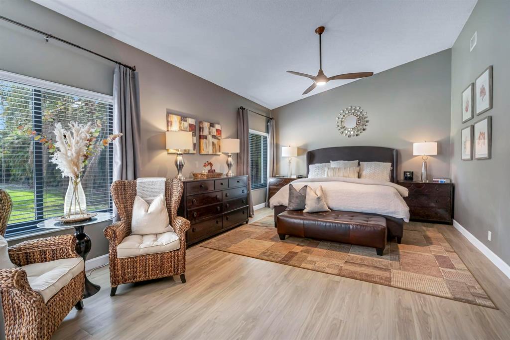 4600 Southwest 164th Terrace Southwest Ranches, FL 33331 - Photo 10 of 36 a bedroom with a large bed couch and a large window