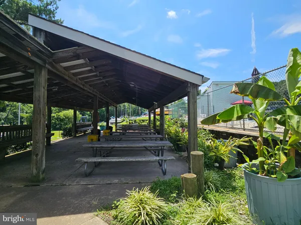 a view of a swimming pool with an outdoor seating