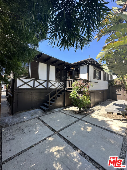 a view of a car park in front of house