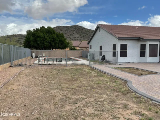 a house with trees in the background
