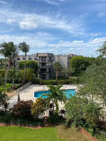a view of a swimming pool with a garden
