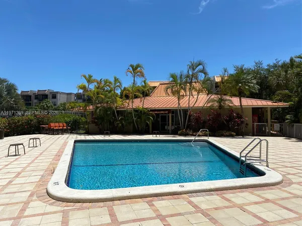 a view of swimming pool with outdoor seating