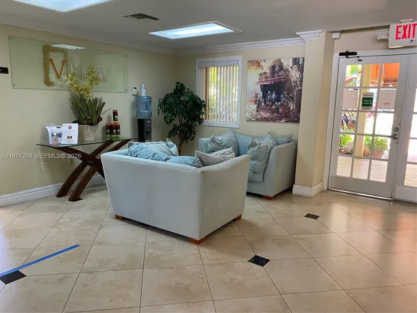 a living room with furniture and a window