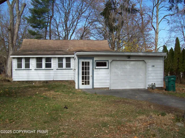 a house with trees in the background