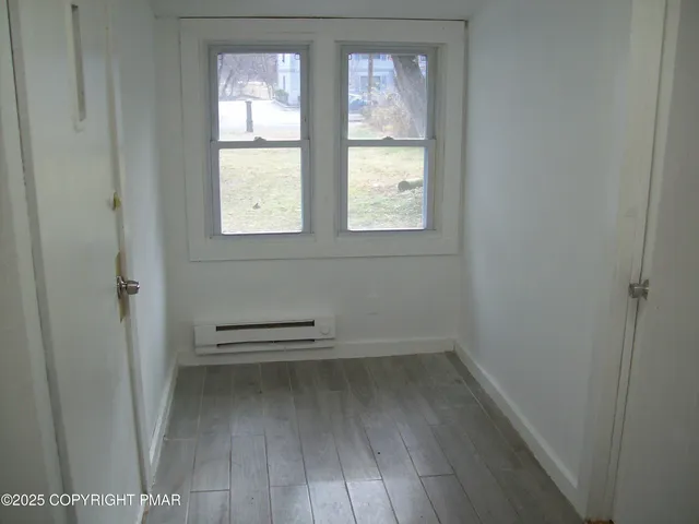 an empty room with windows