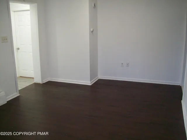 an empty room with a door