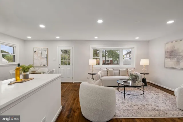 a living room with furniture and a table
