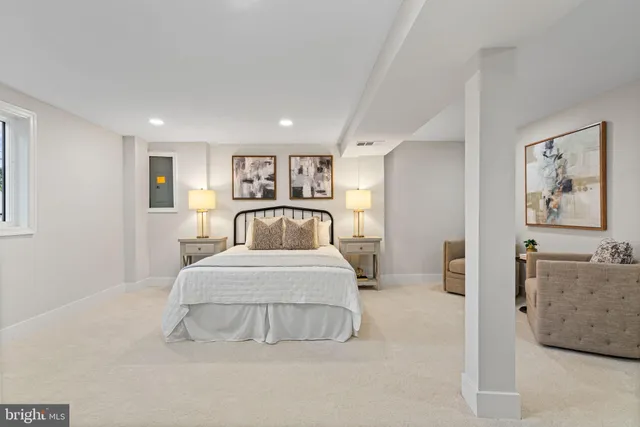 a bedroom with a bed and a couch