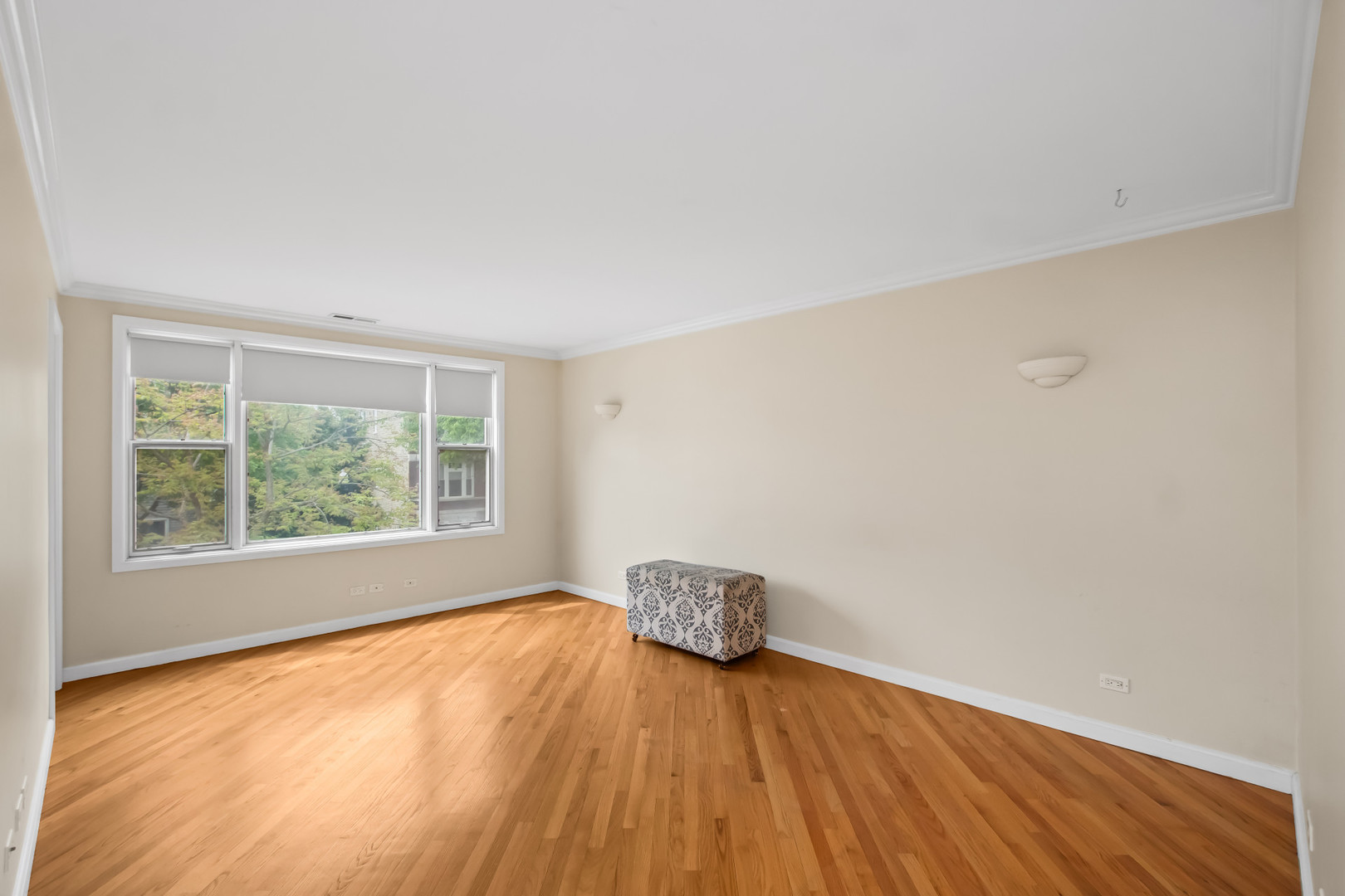 2238 West 21st Place Chicago, IL 60608 - Photo 2 of 37 an empty room with wooden floor and windows