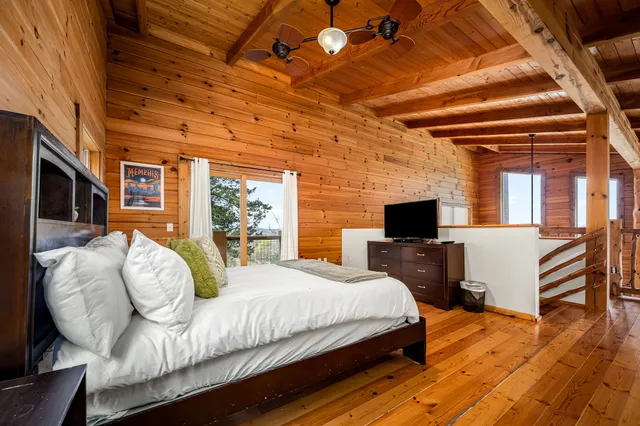 a room with a stove and a painting on the wall