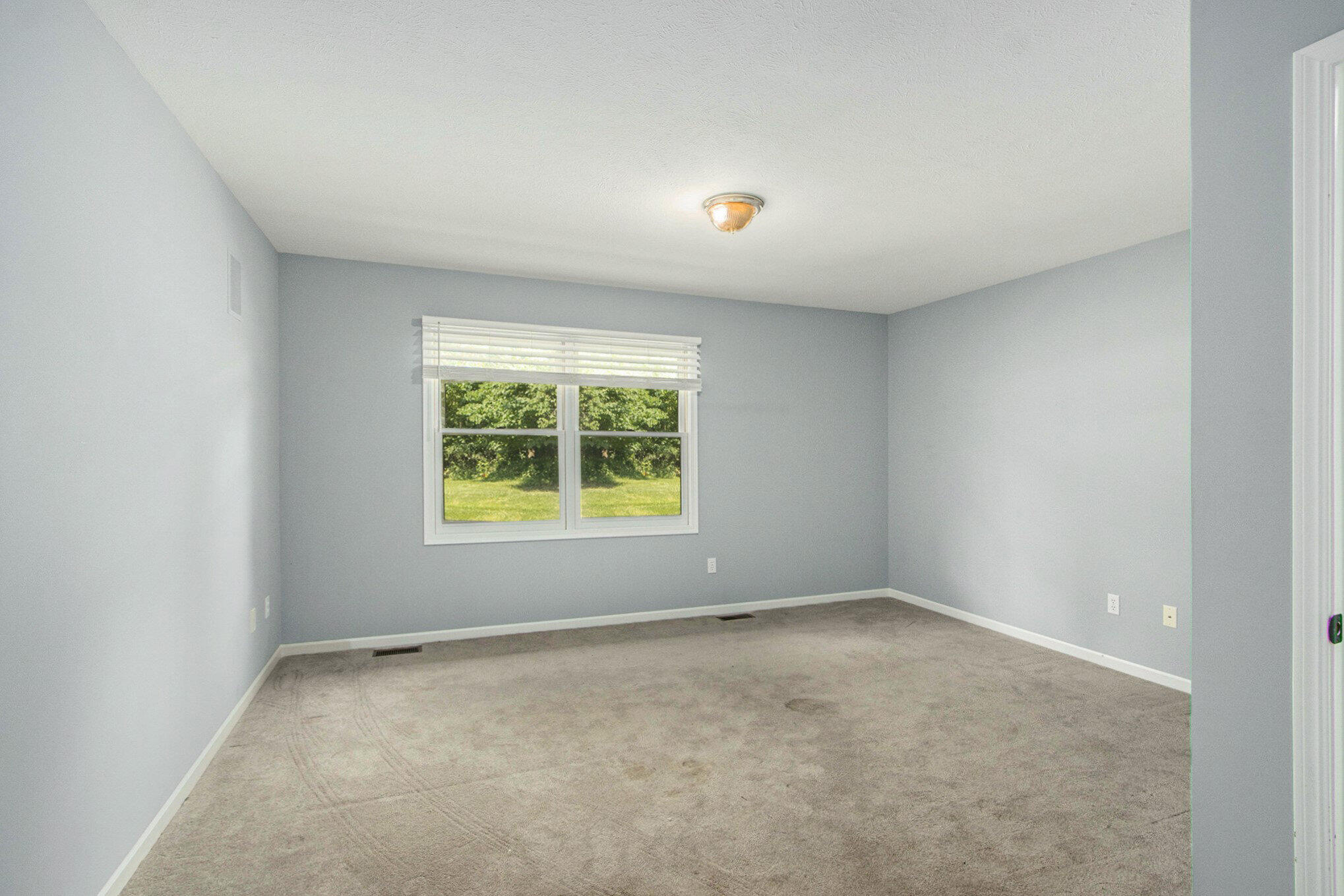 5965 Wood Valley Road Kalamazoo, MI 49009 - Photo 12 of 30 Main floor primary bedroom