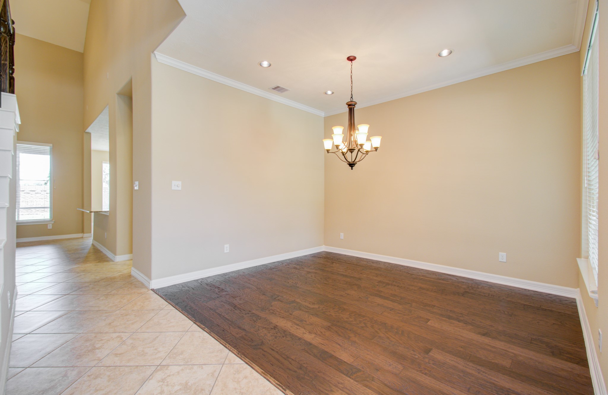 3938 May Ridge Lane Sugar Land, TX 77479 - Photo 4 of 40 wooden floor in an empty room with a window