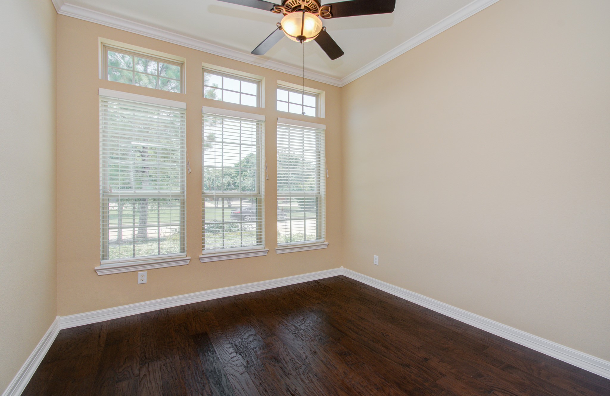 3938 May Ridge Lane Sugar Land, TX 77479 - Photo 6 of 40 a view of an empty room with wooden floor and a window