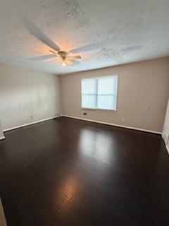 1846 Sturgeon Road Buford, GA 30518 - Photo 11 of 14 an empty room with wooden floor and windows