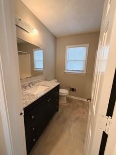 1846 Sturgeon Road Buford, GA 30518 - Photo 12 of 14 a bathroom with a granite countertop bathtub sink vanity and mirror