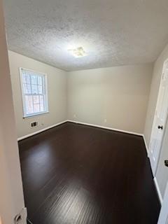 1846 Sturgeon Road Buford, GA 30518 - Photo 13 of 14 an empty room with wooden floor and windows