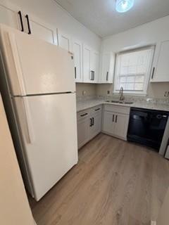 1846 Sturgeon Road Buford, GA 30518 - Photo 3 of 14 a kitchen with cabinets and white appliances