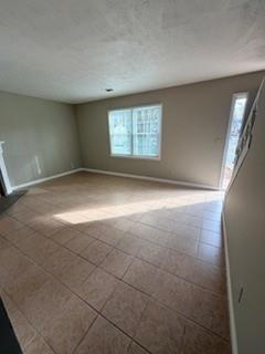1846 Sturgeon Road Buford, GA 30518 - Photo 10 of 14 a view of an empty room with a window