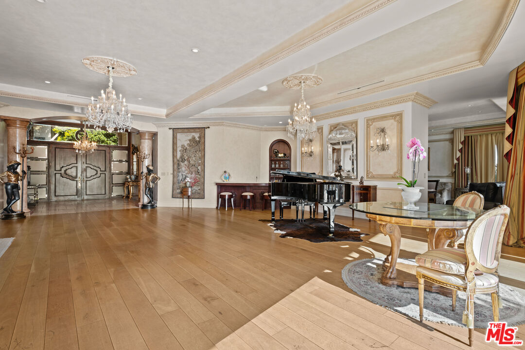 1575 Alexis Place Beverly Hills, CA 90210 - Photo 13 of 75 a living room with furniture and a chandelier