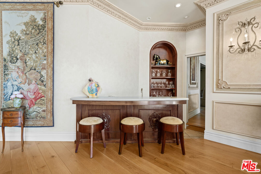 1575 Alexis Place Beverly Hills, CA 90210 - Photo 15 of 75 a view of a dinning room with furniture and wooden floor