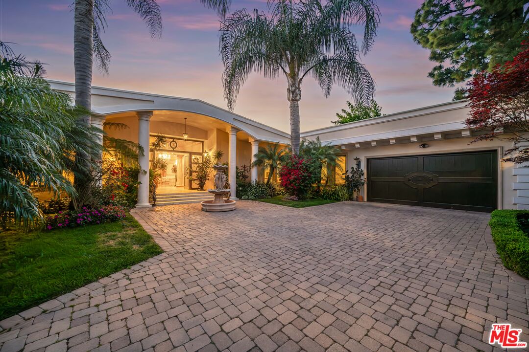 1575 Alexis Place Beverly Hills, CA 90210 - Photo 2 of 75 a front view of a house with garden