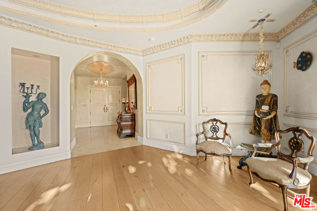 1575 Alexis Place Beverly Hills, CA 90210 - Photo 28 of 75 a view of a livingroom with wooden floor and a ceiling fan