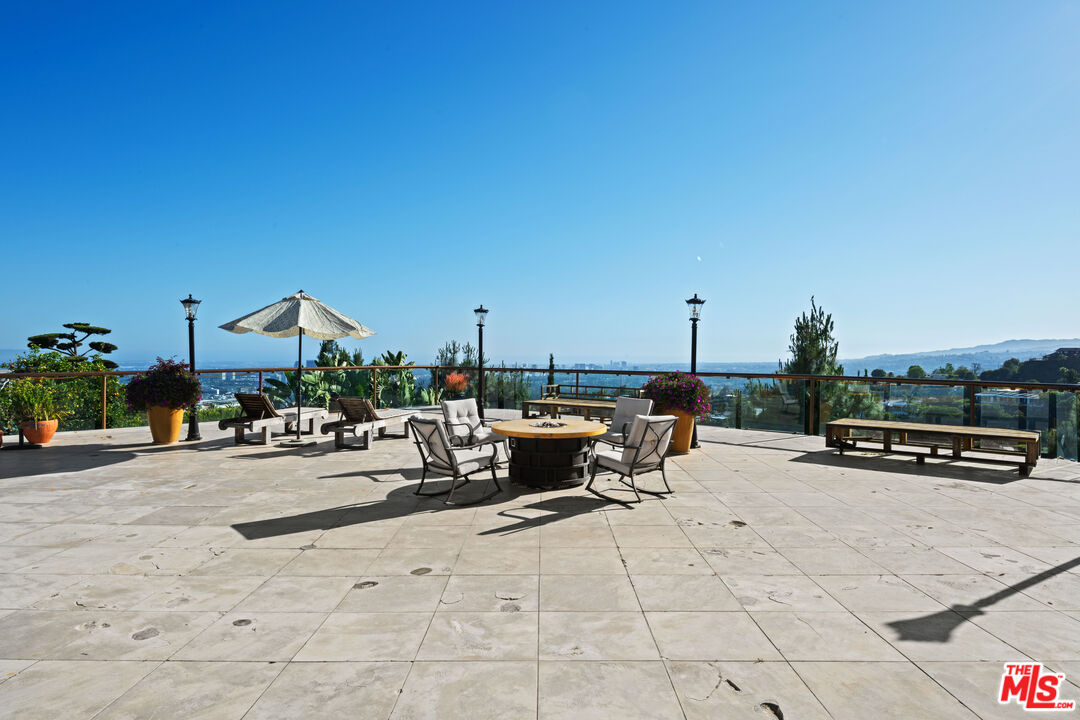 1575 Alexis Place Beverly Hills, CA 90210 - Photo 40 of 75 a view of a terrace with chairs