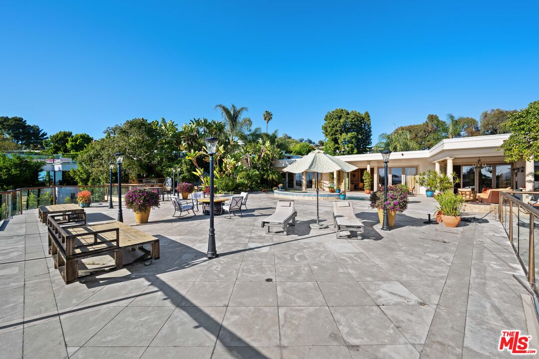 1575 Alexis Place Beverly Hills, CA 90210 - Photo 43 of 75 a view of a patio with chairs and tables