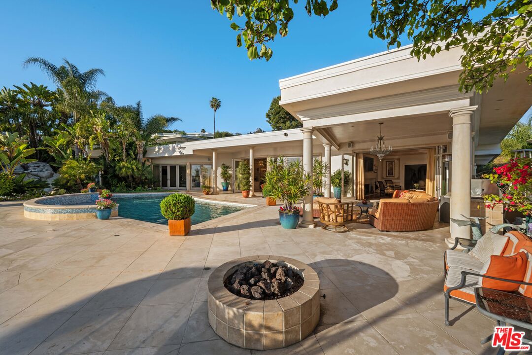 1575 Alexis Place Beverly Hills, CA 90210 - Photo 46 of 75 a view of a house with swimming pool and sitting area
