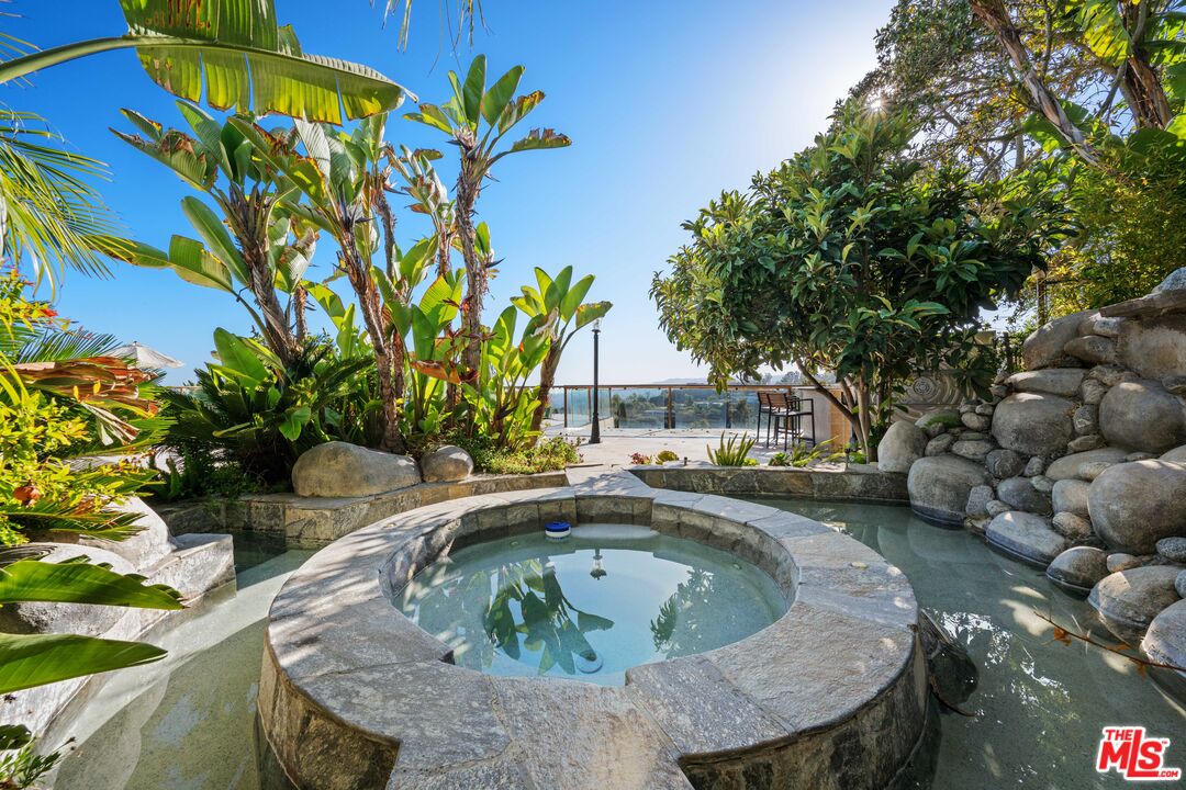 1575 Alexis Place Beverly Hills, CA 90210 - Photo 51 of 75 a view of swimming pool with a yard