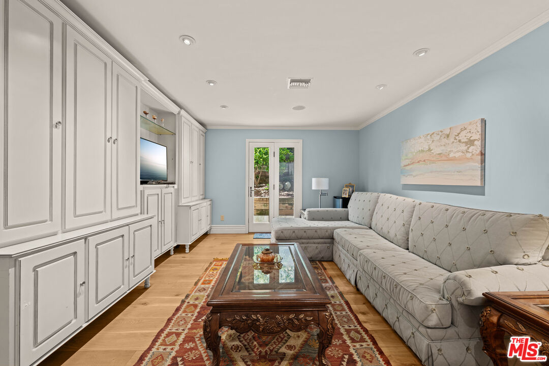 1575 Alexis Place Beverly Hills, CA 90210 - Photo 54 of 75 a living room with furniture and a large window