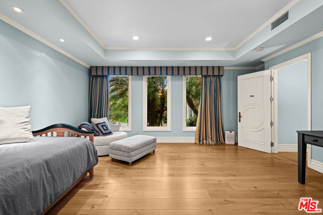 1575 Alexis Place Beverly Hills, CA 90210 - Photo 56 of 75 a bedroom with double bed and a large window